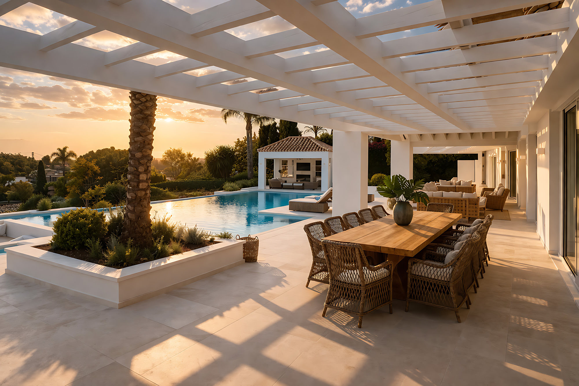 Covered outdoor dining terrace with pergola, lounge seating and long Mediterranean views at Villa Adriana