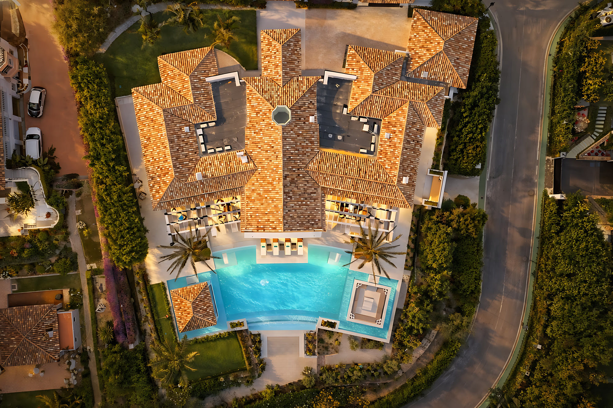 Aerial top view of Villa Adriana showing tiled roofscape, swimming pool, landscaped garden and full plot layout in La Cerquilla