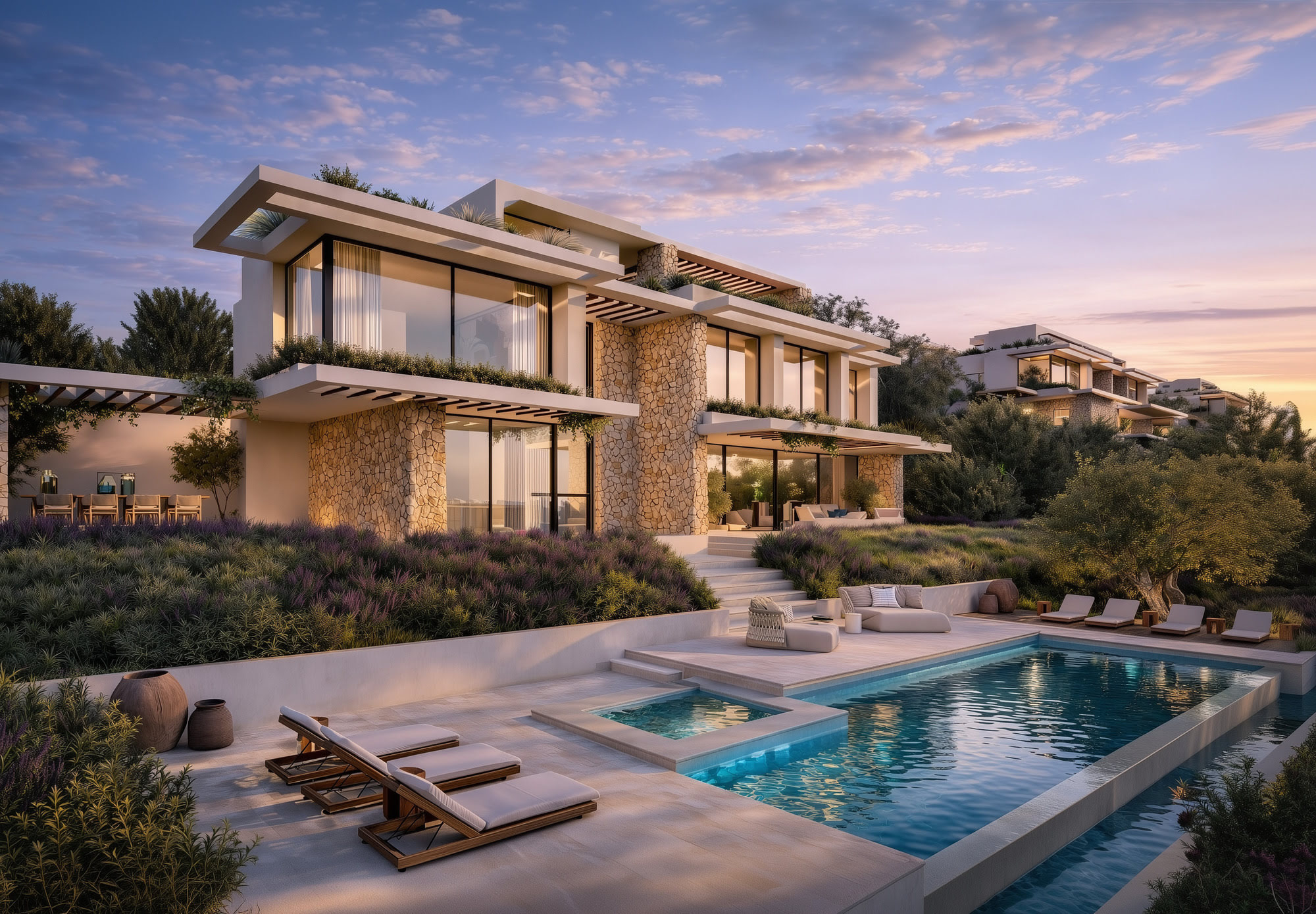 Wide evening view of La Alborada villa and pool, showing the full residential composition integrated into the hillside