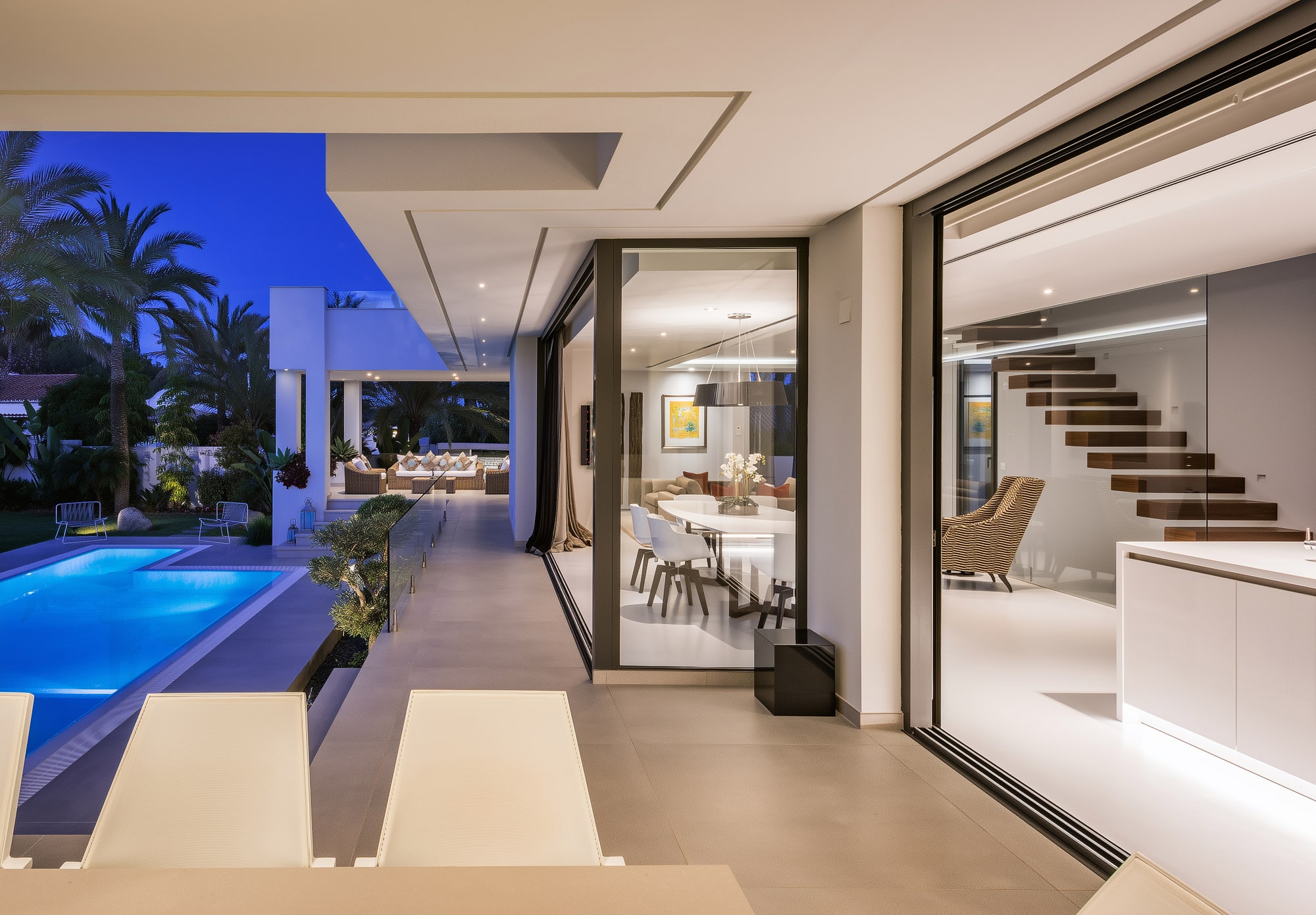 Open-plan interior facing the pool terrace at Villa Australia, dissolving the boundary between inside and outside