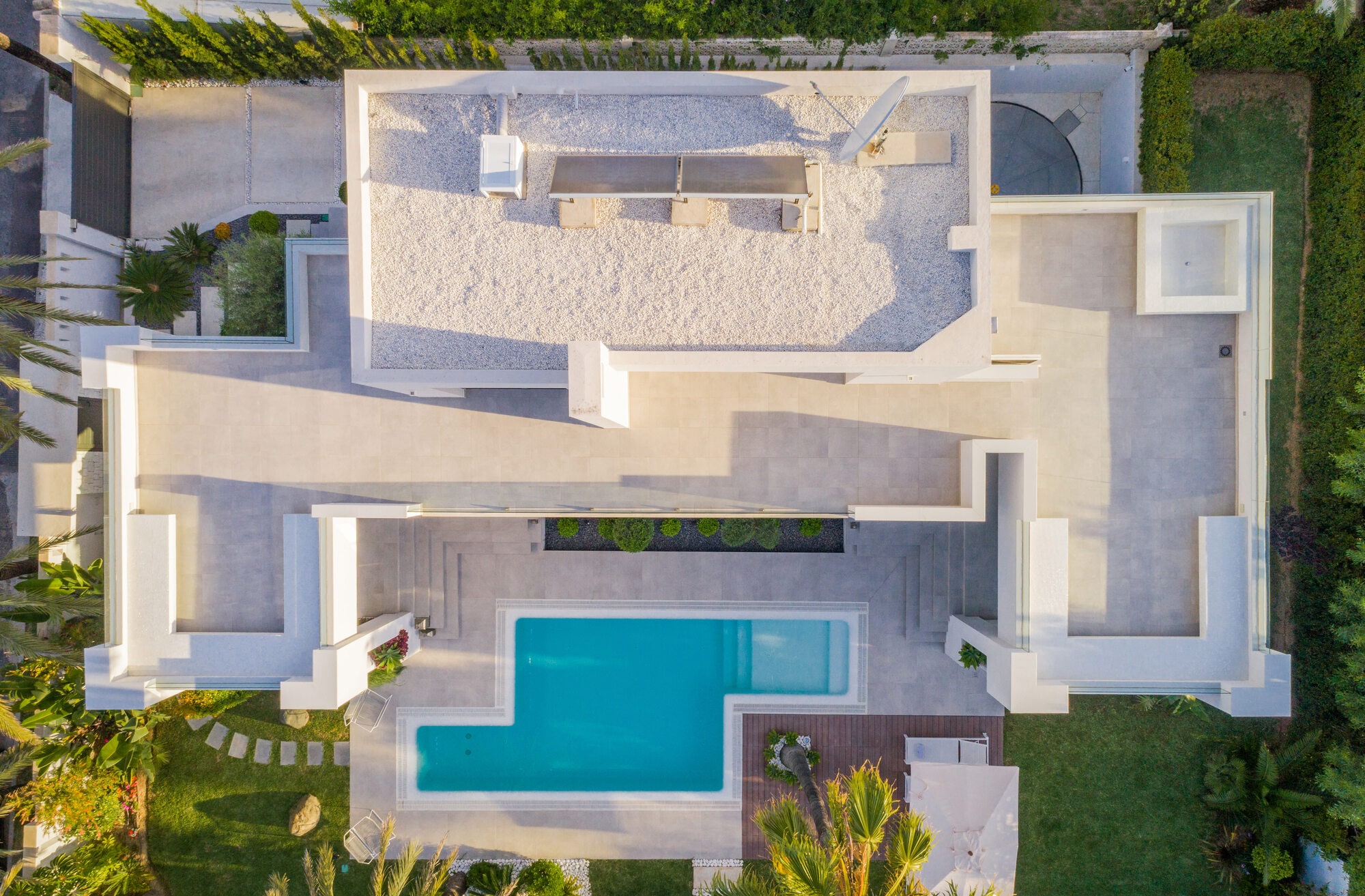 Aerial top view of Villa Australia showing roofscape, pool geometry, sun terraces and overall plot composition