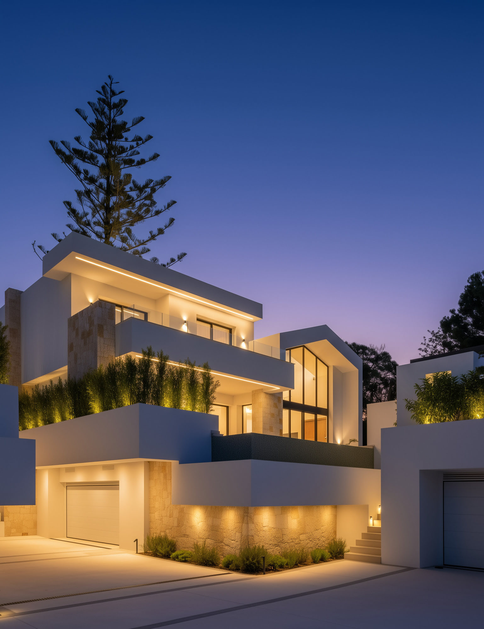 Villa exterior at twilight with architectural lighting highlighting volumes