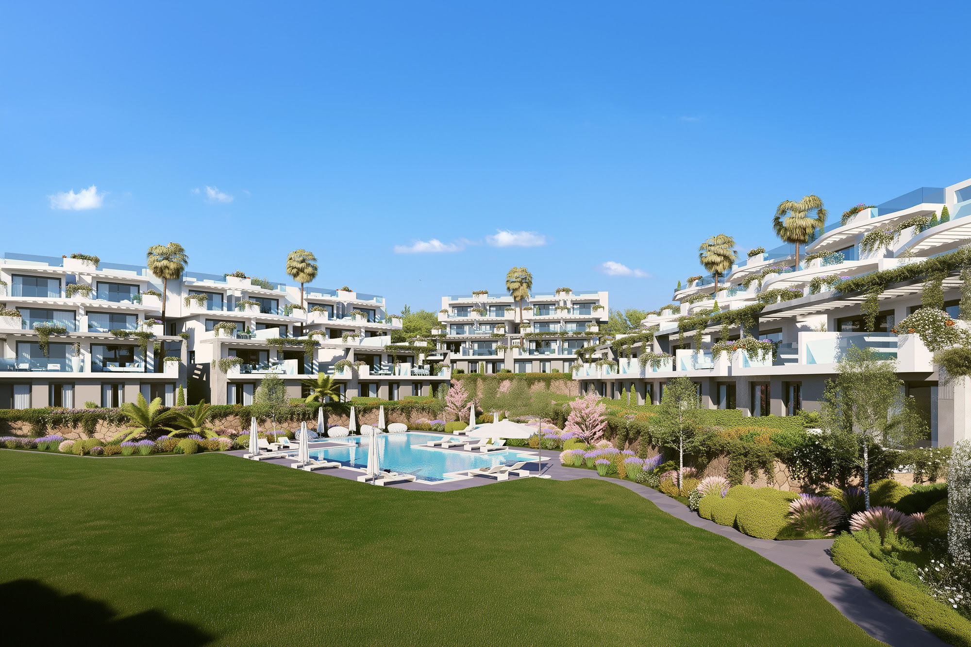 Daytime overview of CALASOL gardens and pool framed by terraced residential architecture in La Cala de Mijas