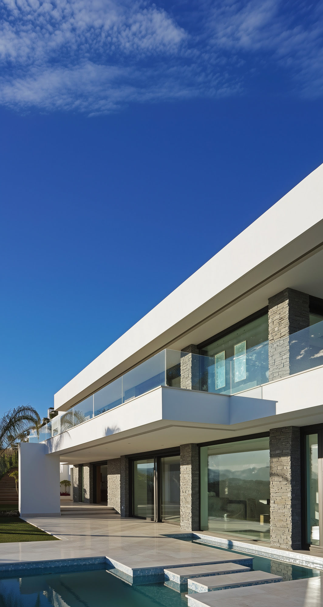 Villa Casalina exterior corner above the pool with minimalist geometry and refined Mediterranean light