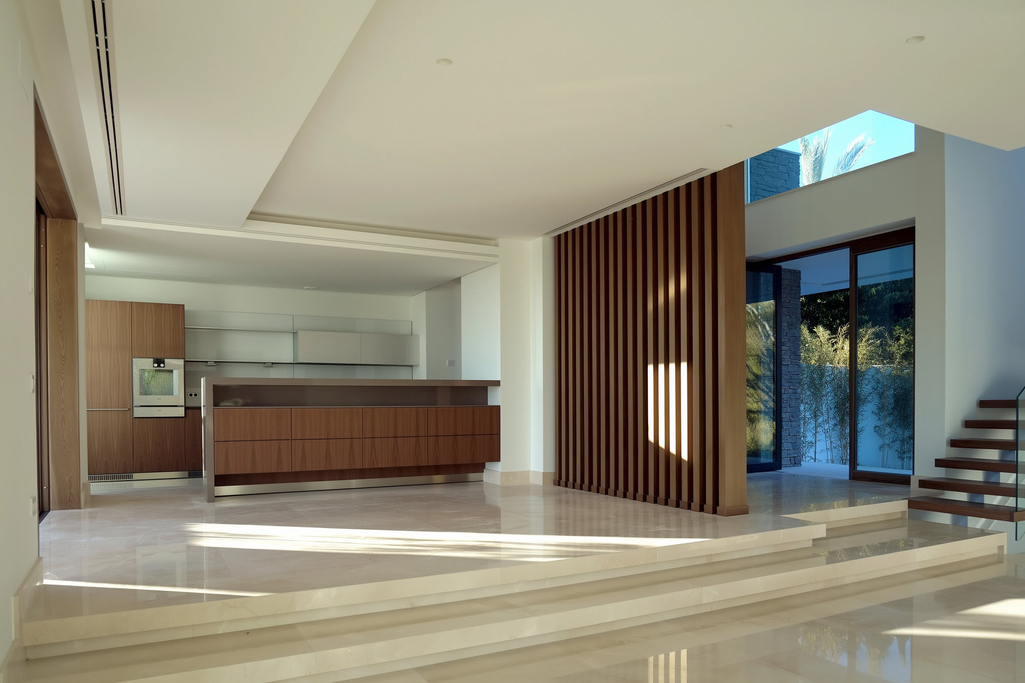 Villa Casalina interior living area with warm wood paneling, bespoke joinery and luminous proportions