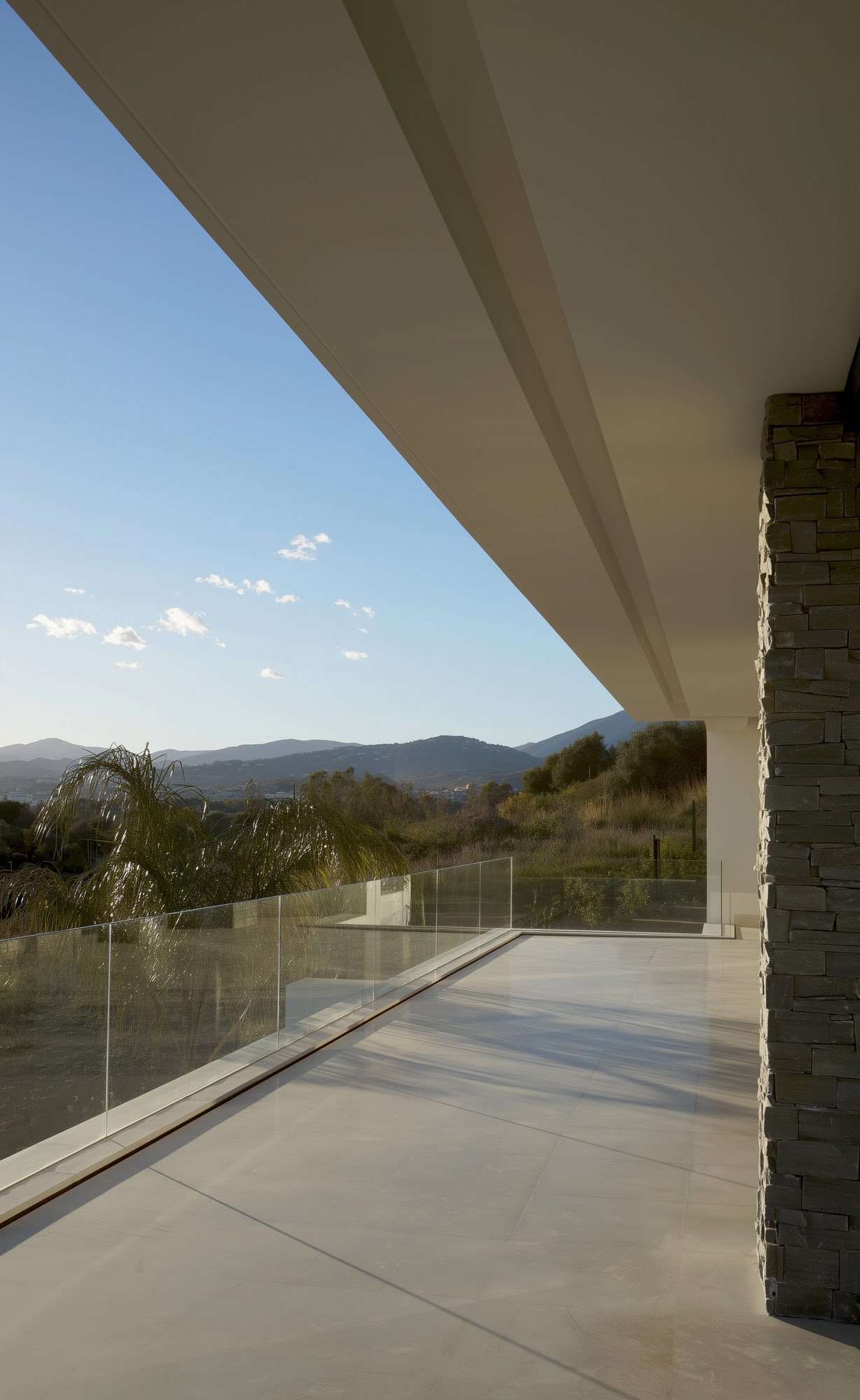 Villa Casalina terrace outlook with framed sea horizon and minimalist Mediterranean outdoor space