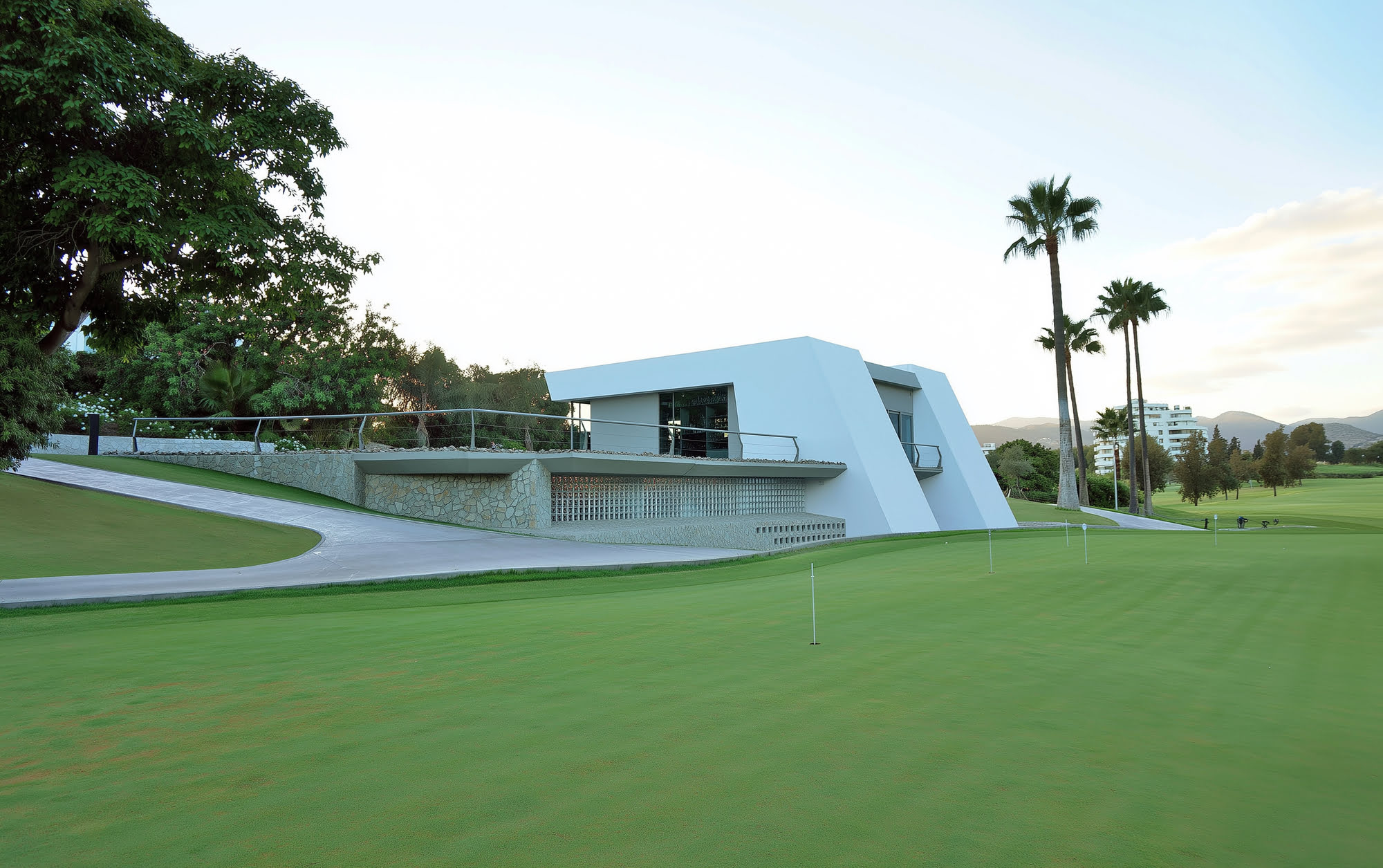 Panoramic view of the Guadalmina golf clubhouse set low against the fairway and surrounding landscape