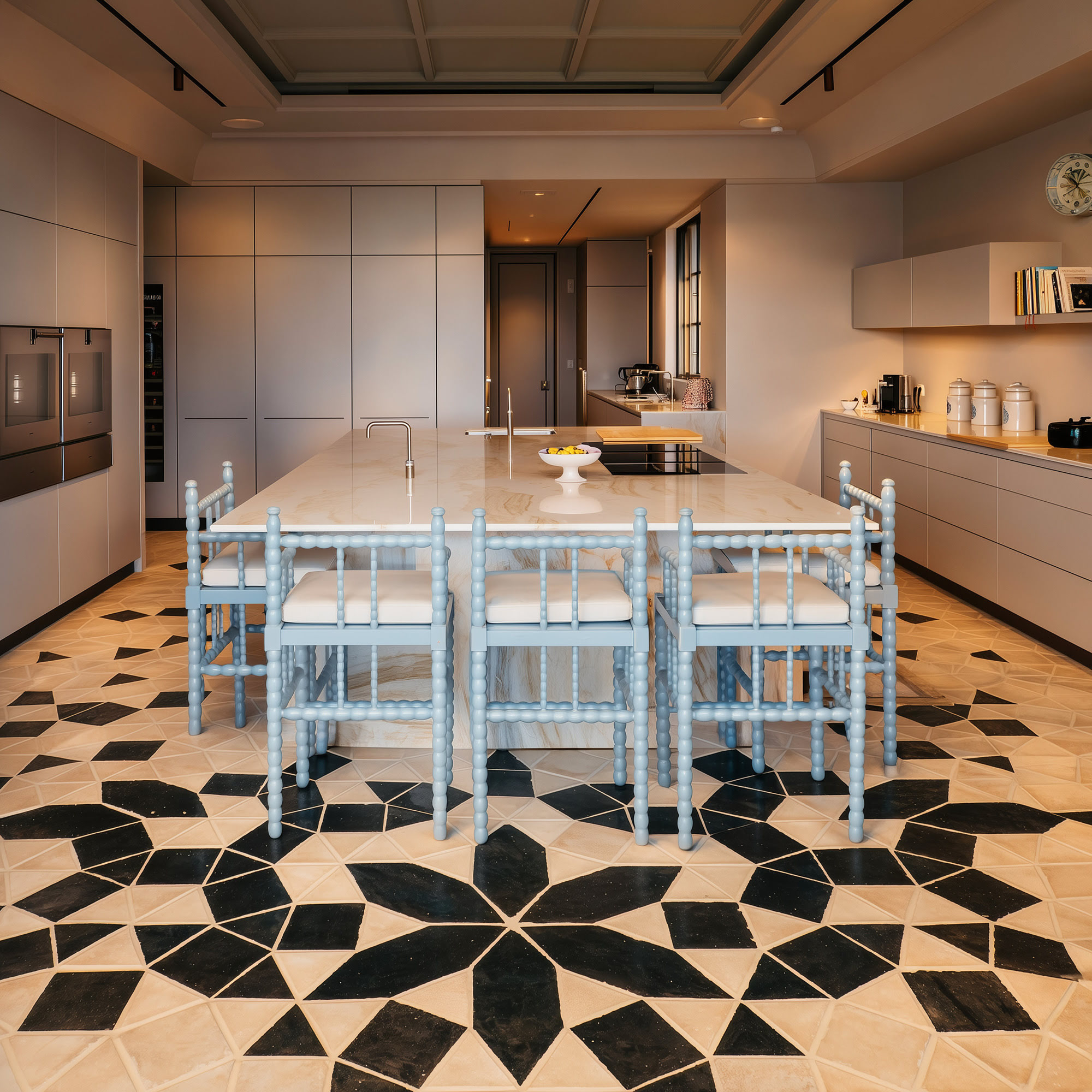 Designer kitchen at Villa Diva with geometric stone flooring, island and bespoke cabinetry