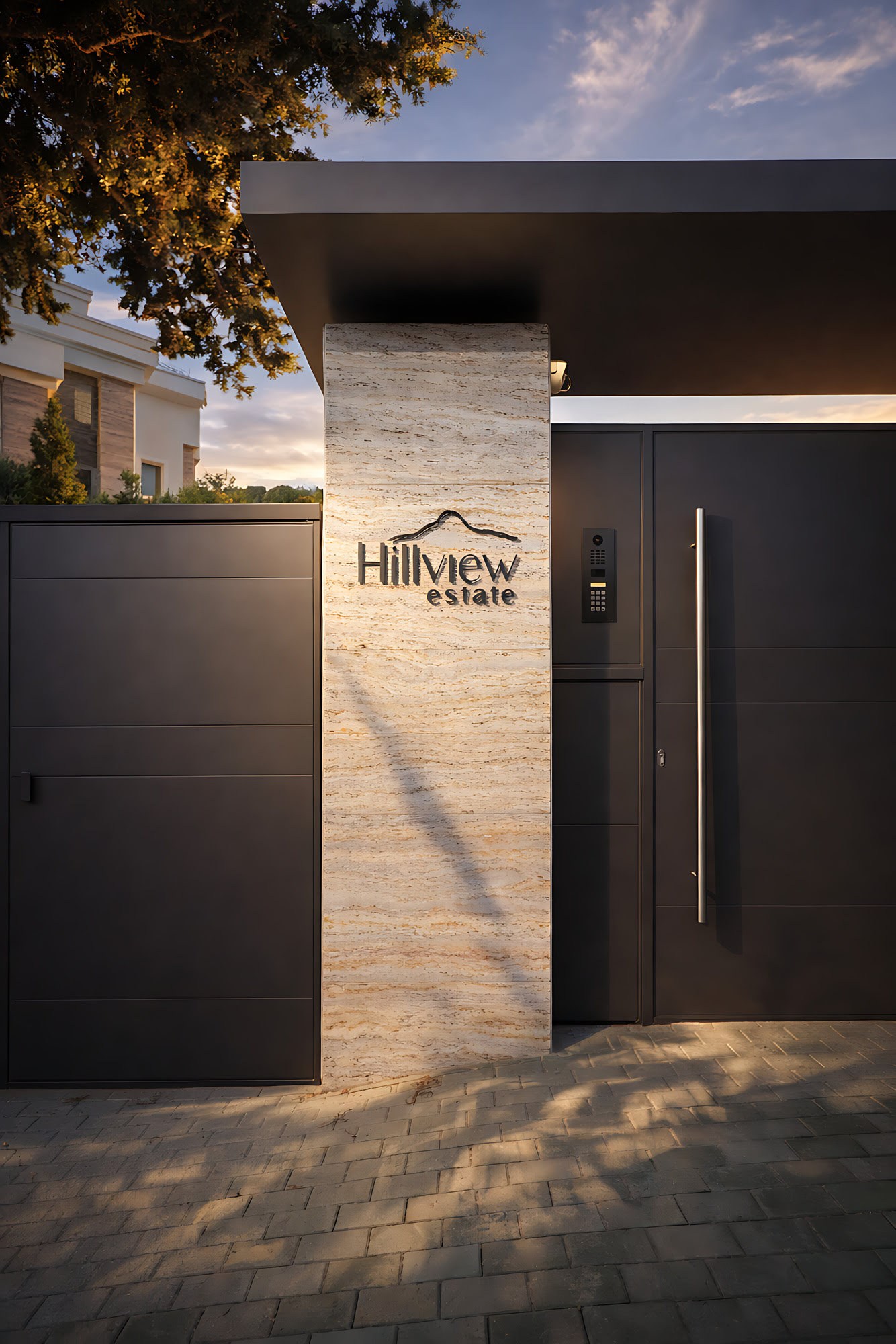 Hillview Estate entrance sign in Los Monteros, Marbella, set against stone cladding and warm evening light