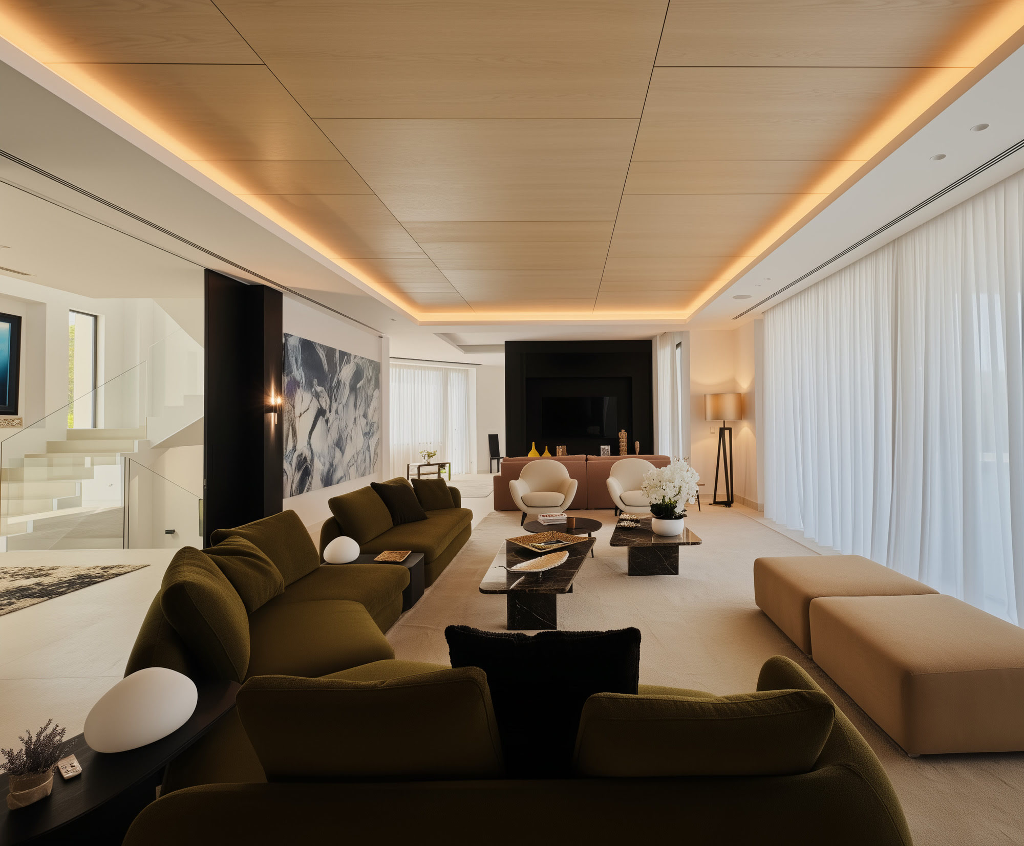 Secondary lounge at Hillview Estate with layered lighting, warm neutrals and direct views to the pool terrace