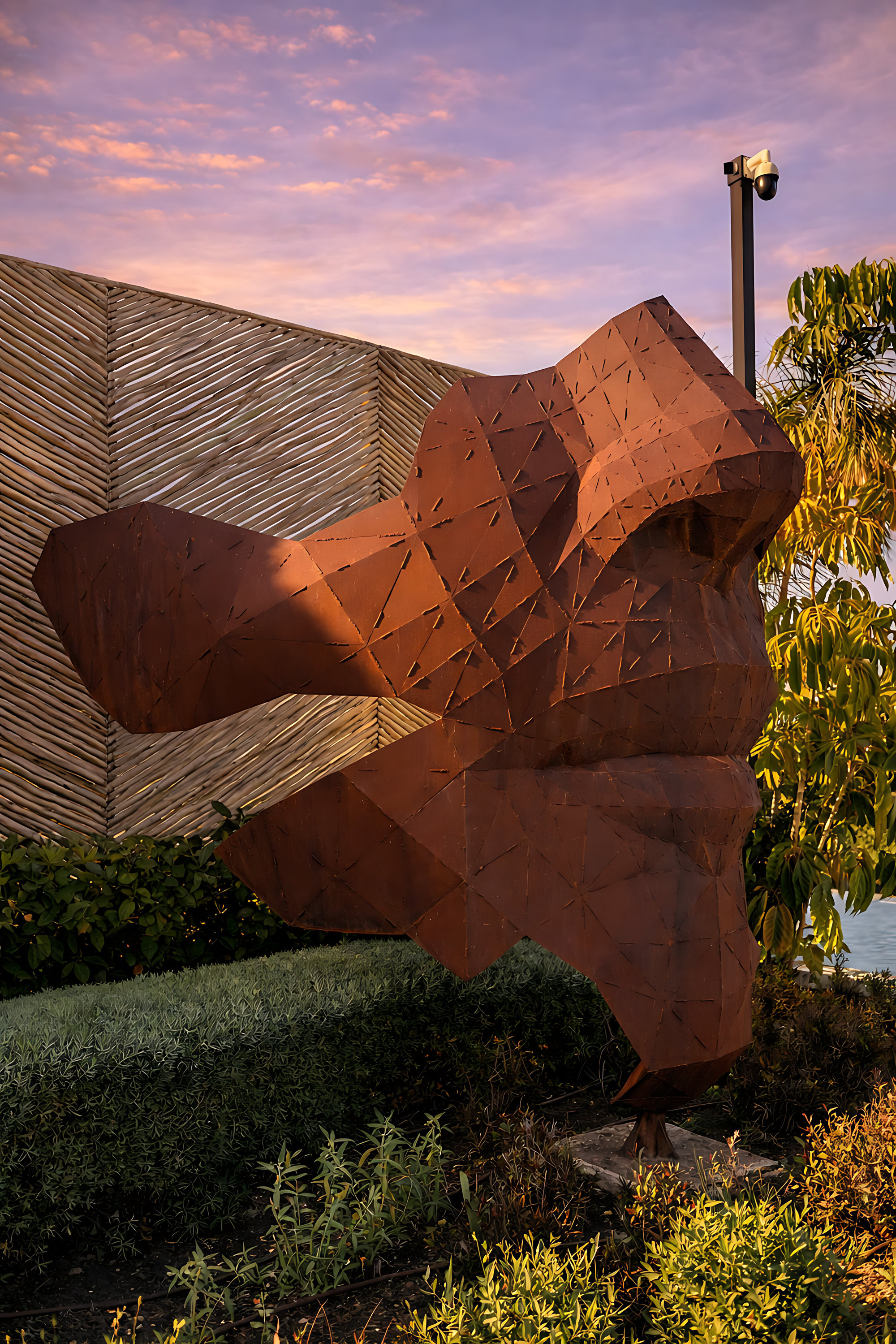 Sculptural garden artwork at Hillview Estate adding an artistic focal point to the landscaped exterior composition