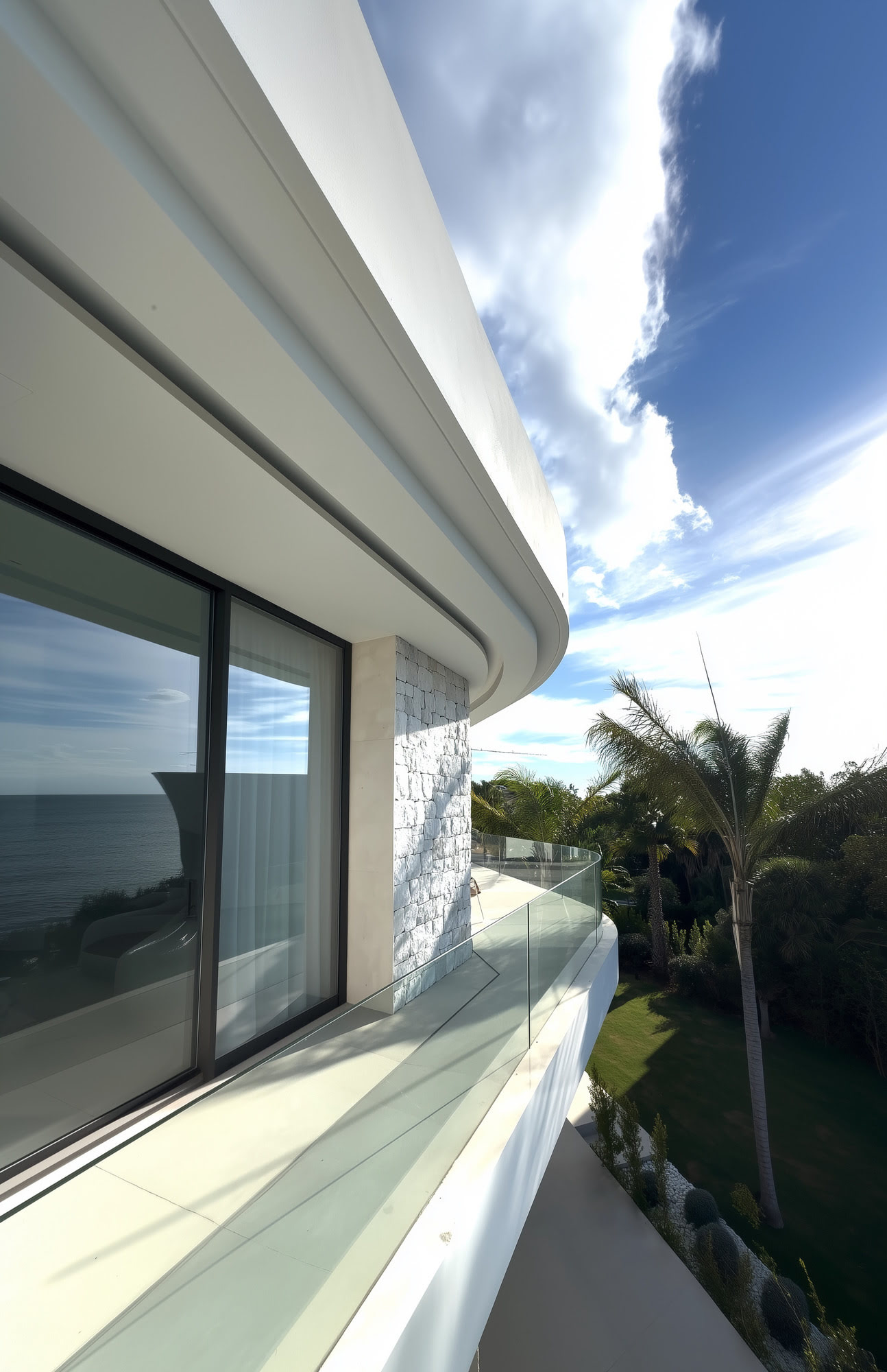 Linear side terrace at M94 with full height glazing, deep overhangs and distant views