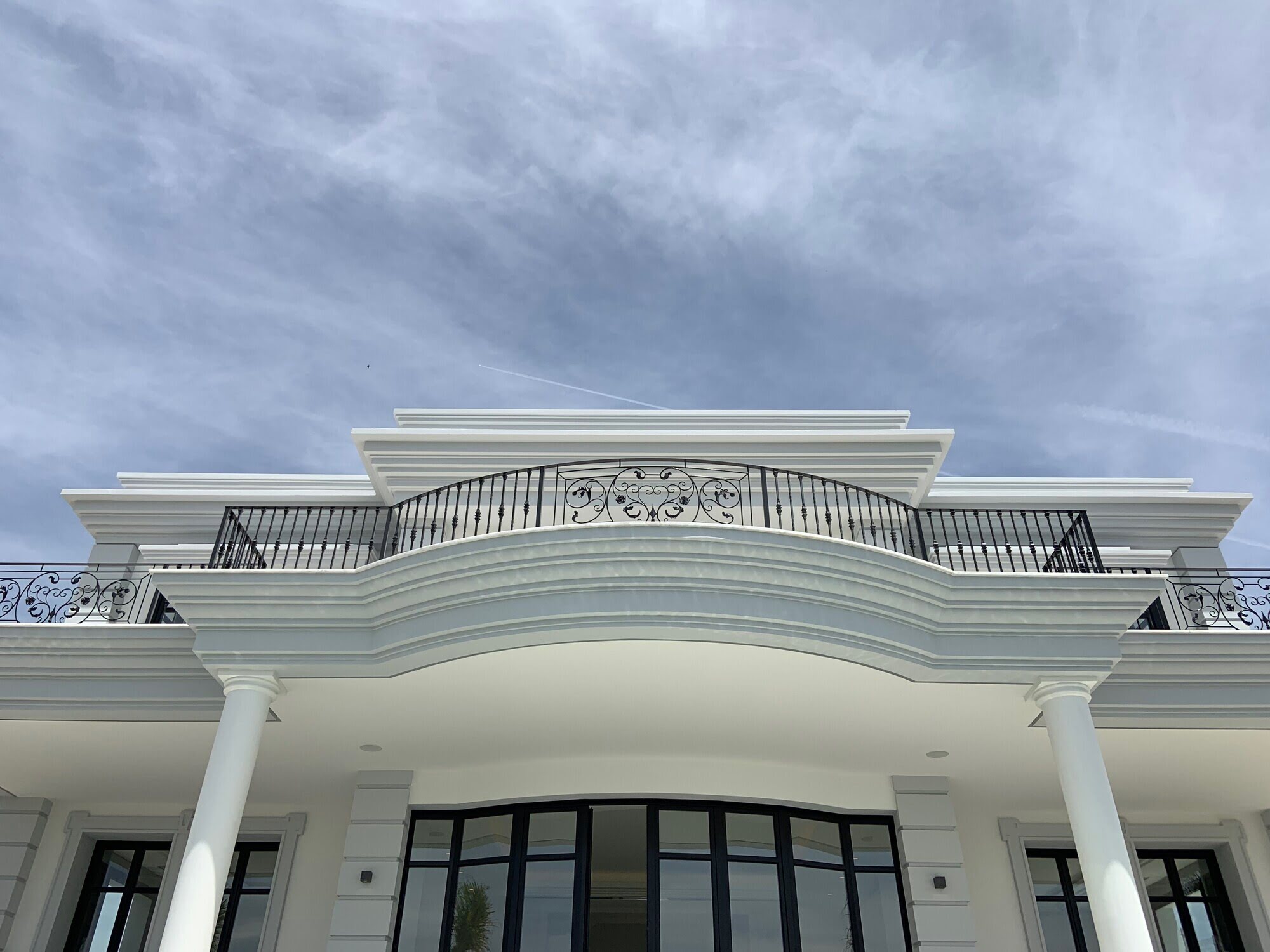 Ornamental classical pediment and carved façade detail at Villa Mariselena in La Zagaleta
