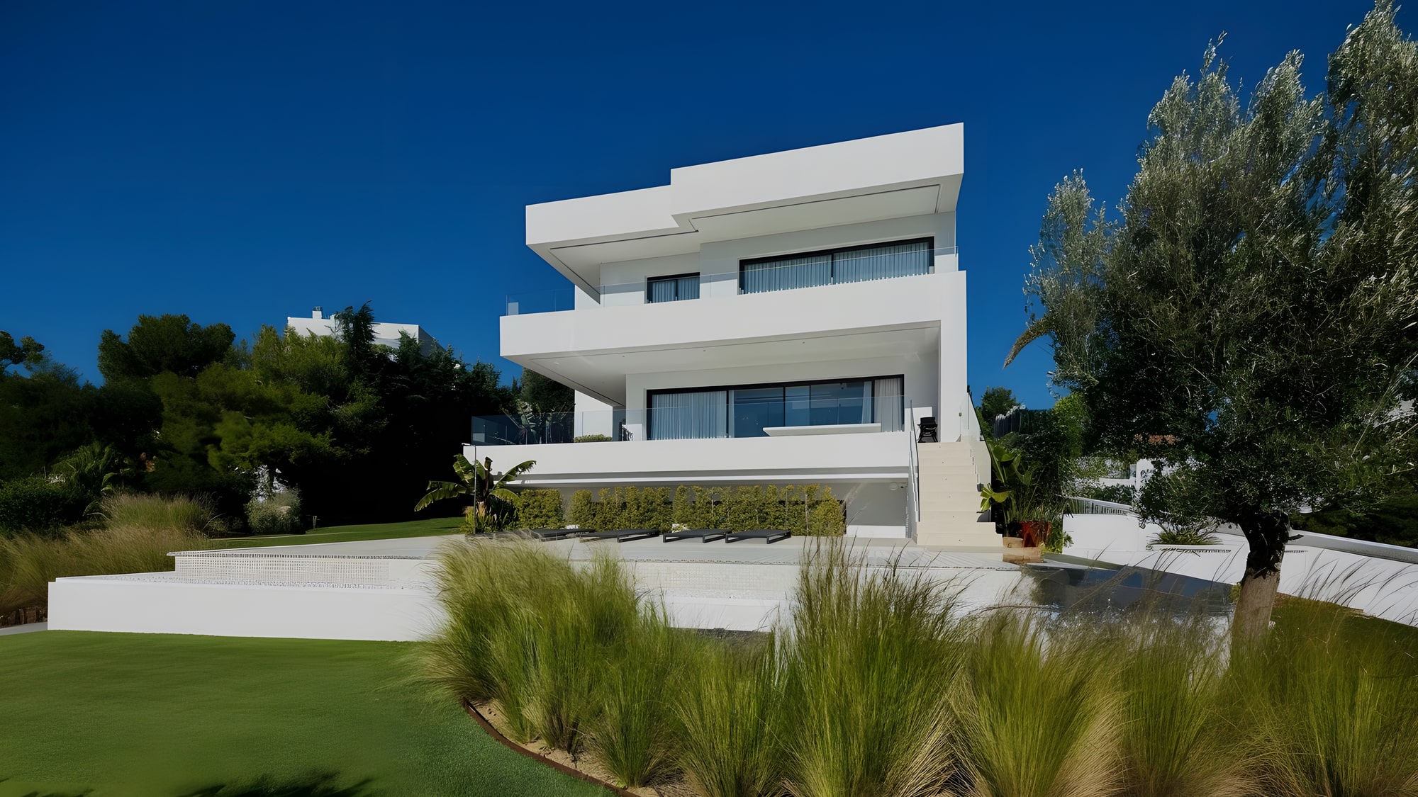 Front garden elevation of Casa Sonuwe with layered terraces and landscaped approach