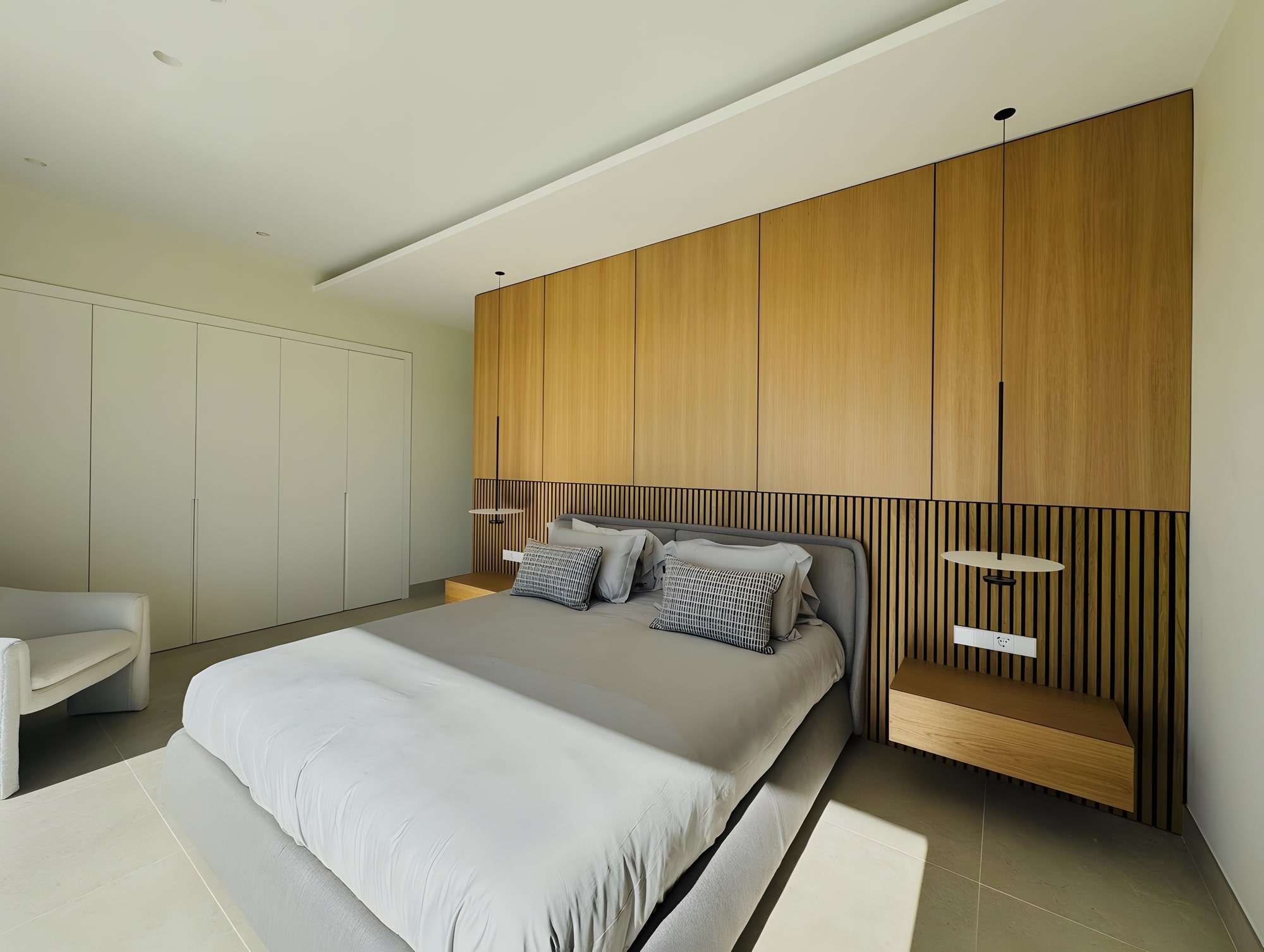 Bedroom with timber headboard wall and calm minimalist styling