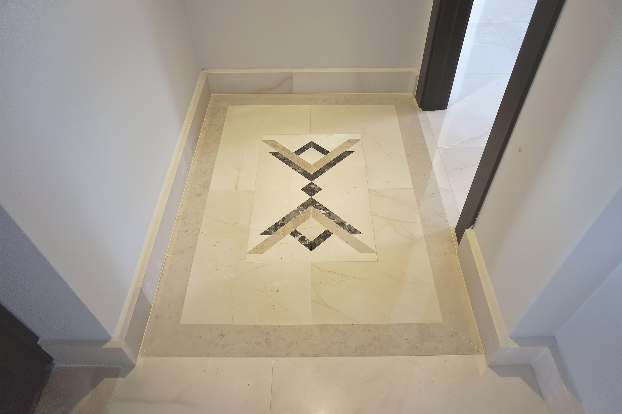 Close-up of classical stone floor pattern and geometric inlay at Villa Tanya