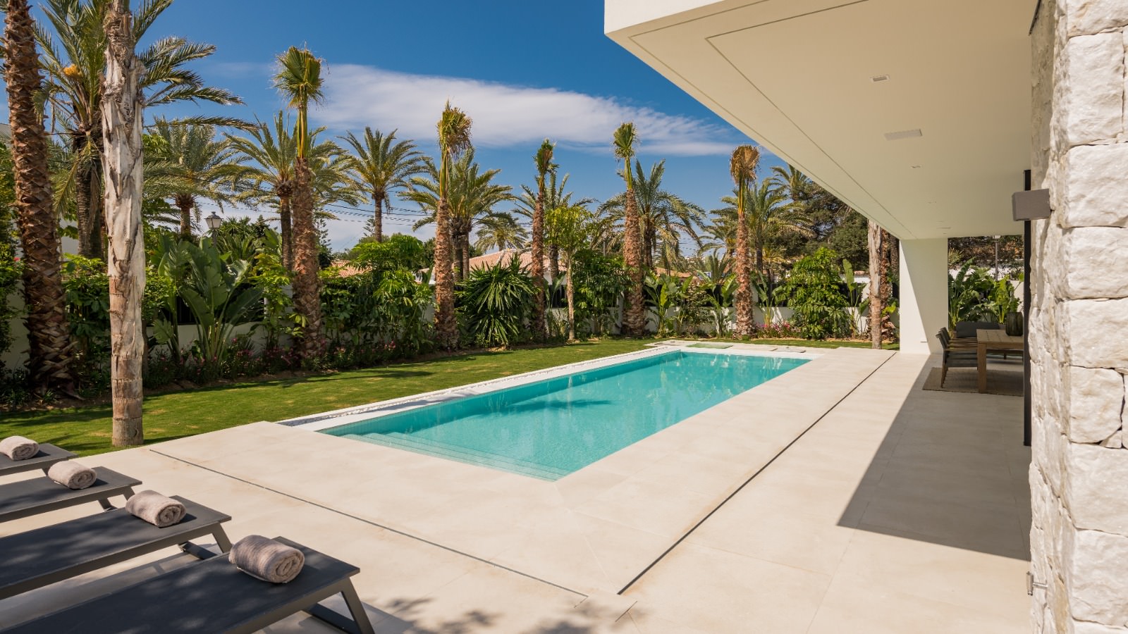Poolside terrace at VIDA DEL MAR with shaded outdoor living and a strong connection to the landscaped garden
