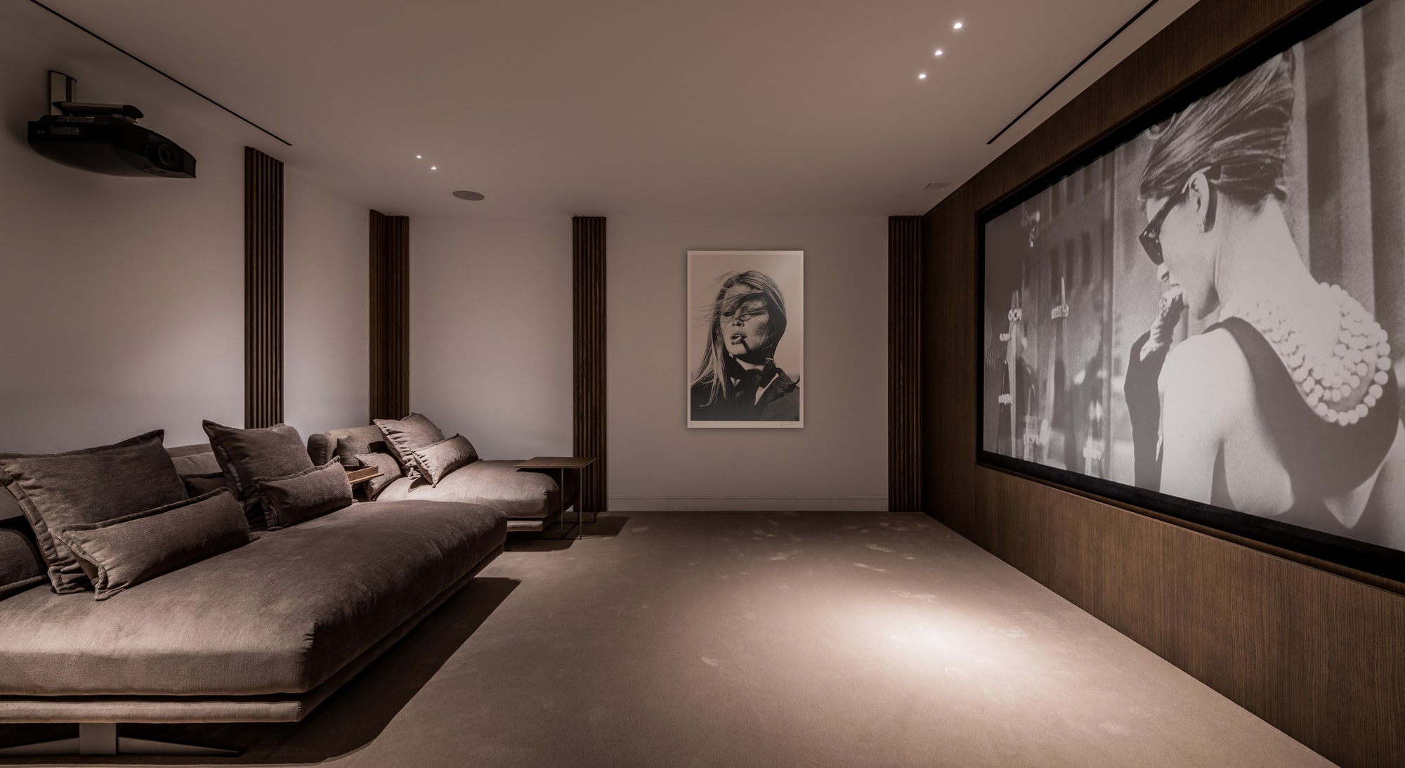 Cinema room at Villa Zarina with oversized lounge seating, subdued lighting and a private entertainment atmosphere