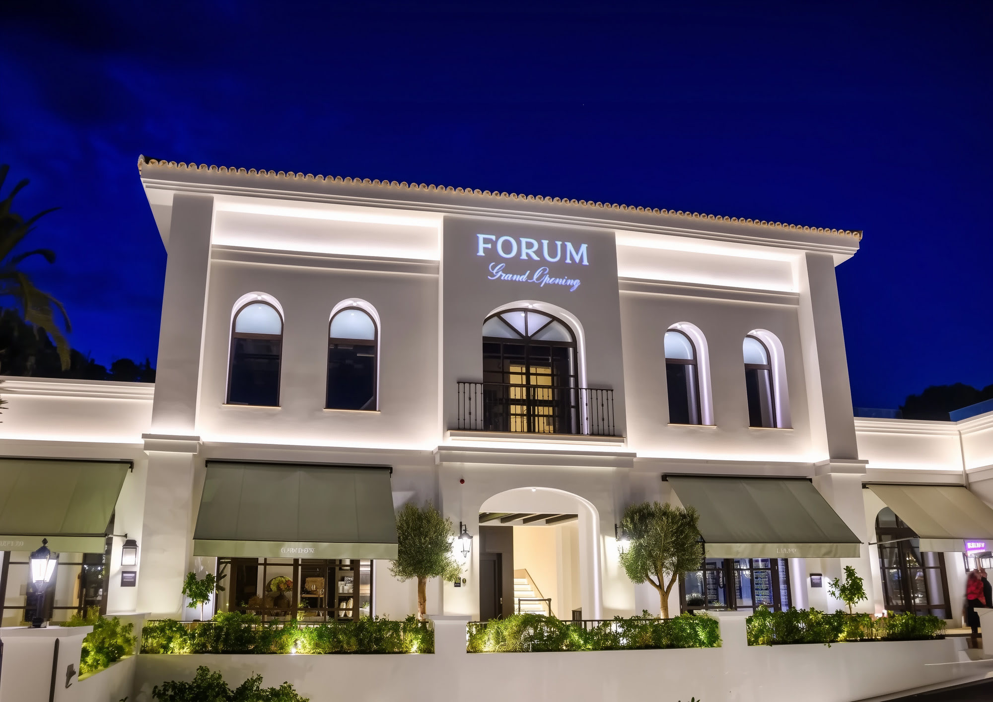 FORUM – classical-style commercial building in Marbella illuminated at night